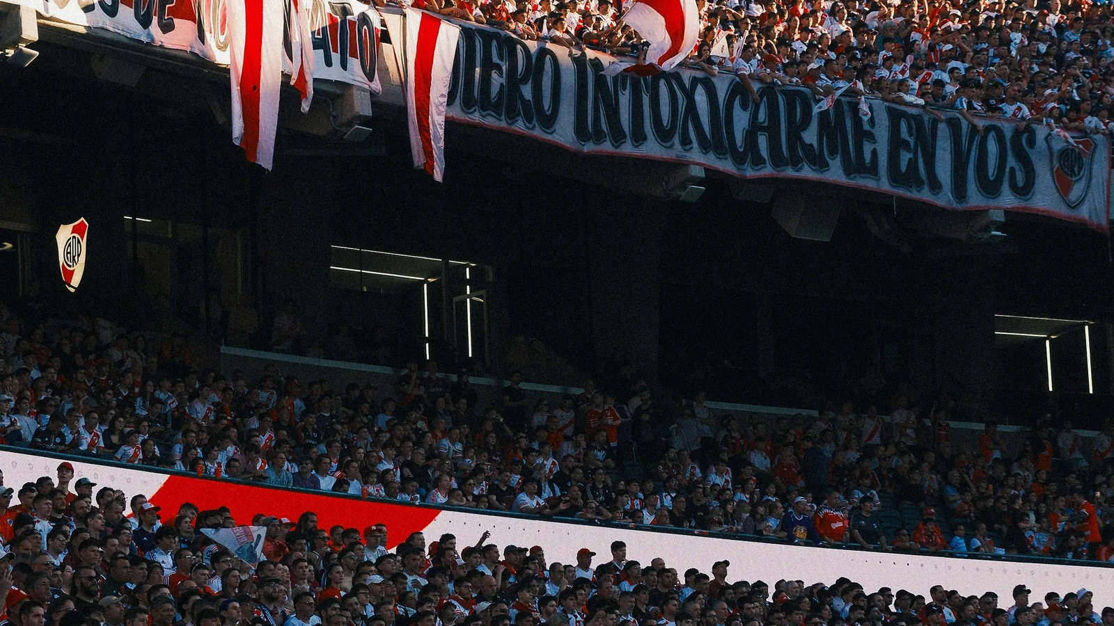 Argentina supporters fill a stadium with blue-and-white flags — Lionel Messi scored twice to break the all-time World Cup goals record as Argentina beat Austria 2-0 in Group J