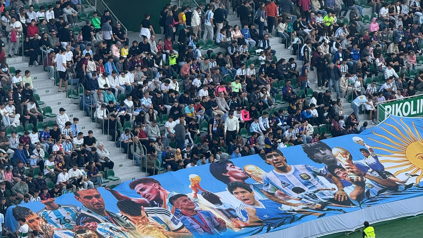Argentina supporters wave flags in the stands, evoking Argentina's 3-2 extra-time win over Cape Verde in the World Cup 2026 Round of 32 in Miami on July 3