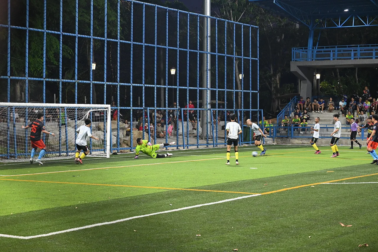 A goalkeeper dives to make a save under floodlights — Cape Verde's Vozinha kept Spain out for a 0-0 draw at Atlanta Stadium on June 15