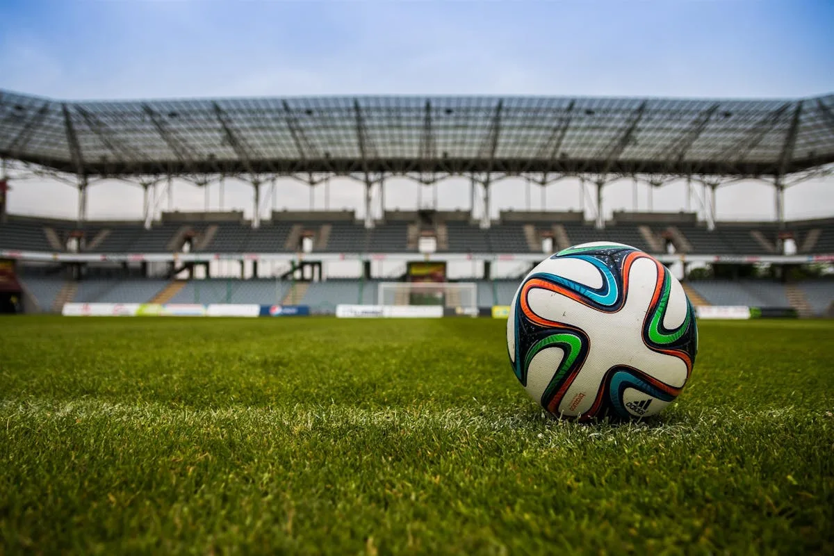 A bright aerial view of a stadium before a major football match